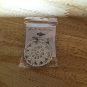 White crochet earrings with shepherd hook